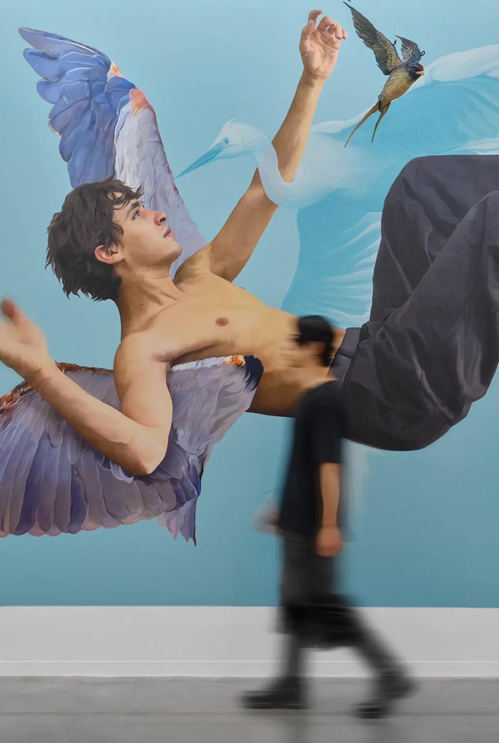 Fernando Icazbalceta in a blue bird artwork by Ricardo Luevanos